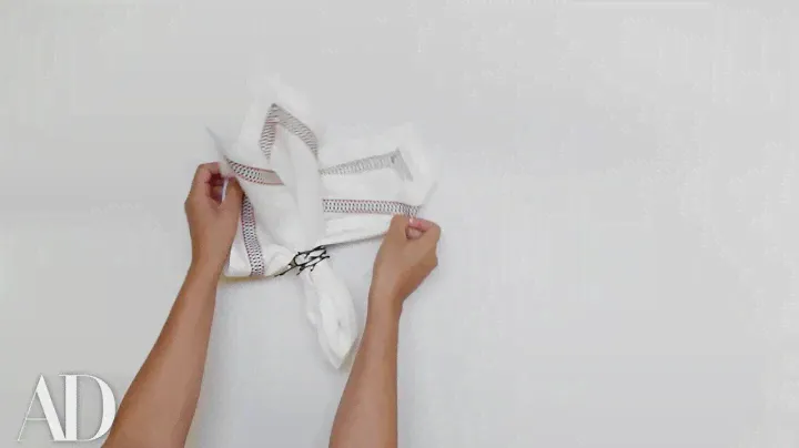 How to Fold a Napkin for a Dinner Party: The Classic Ring Stuffer | Architectural Digest